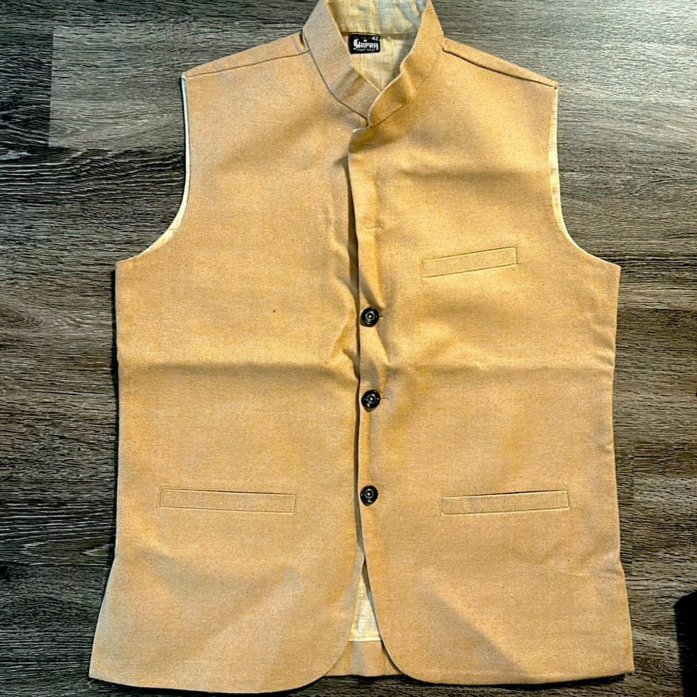 It a nice jacket from India in Beige color.